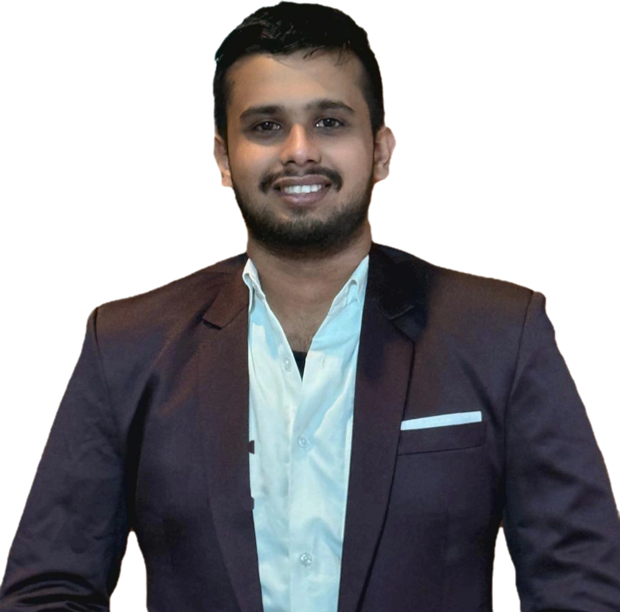 Man in a dark blazer and white shirt smiling.