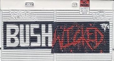 Graffiti of 'BUSH' and 'VILLAEO' on a metal shutter.