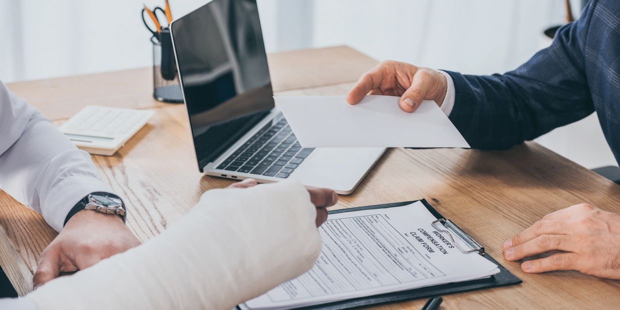 man in cast filling out paperwork