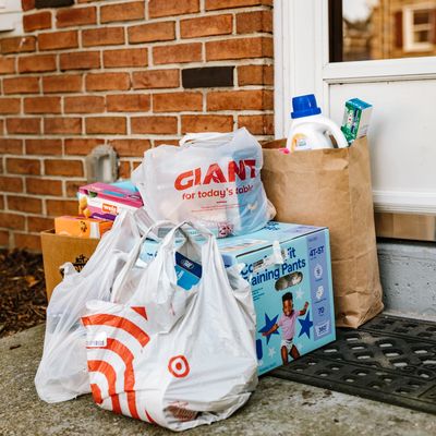 Bags of groceries sitting outside of front door