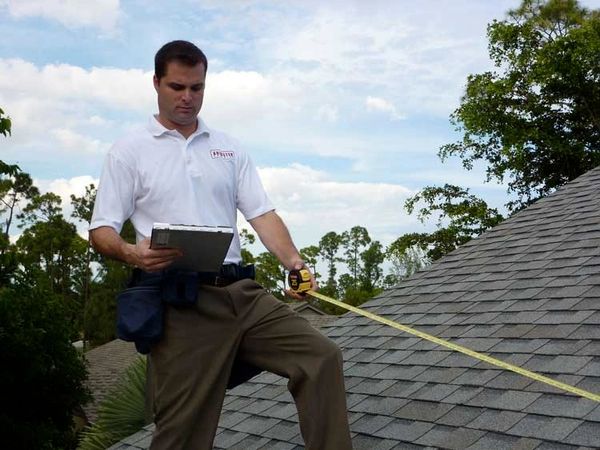 Field Adjuster measuring roof