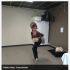 Person in costume dancing indoors
