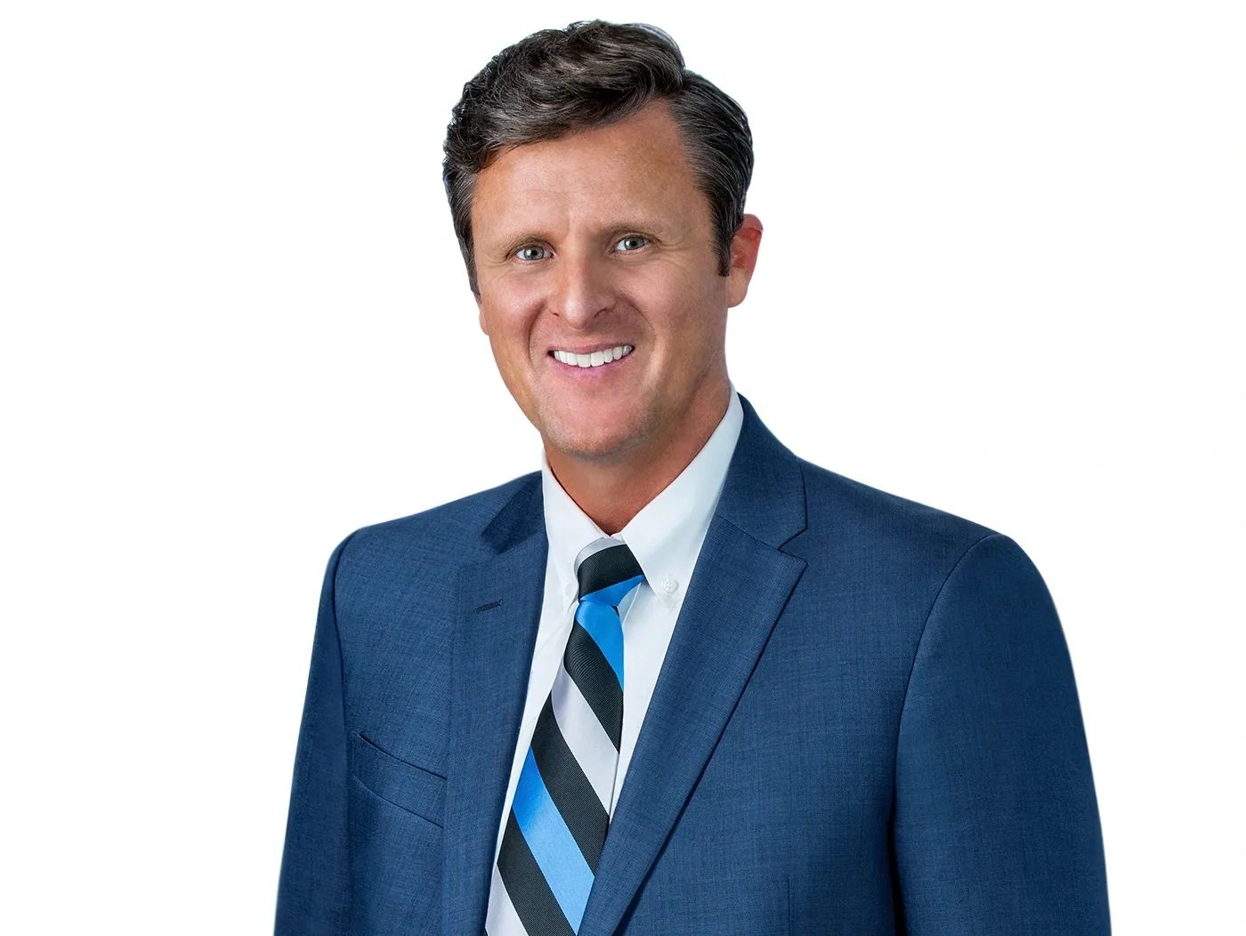Professional man in blue suit and striped tie smiling.