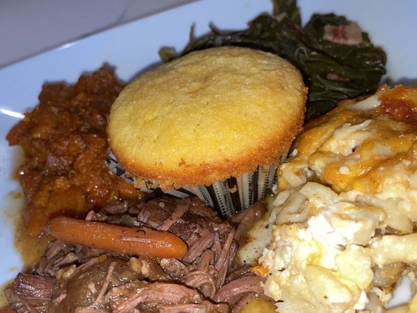 pot roast, sweet potatoes,baked mac, greens and honey butter cornbread