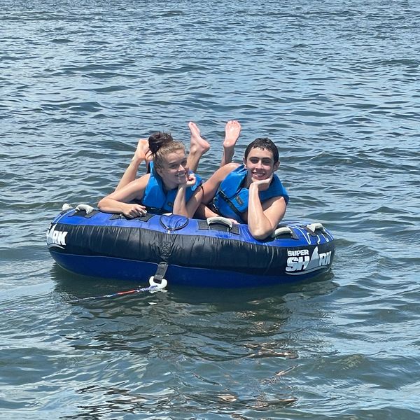2 kids on a floating device 