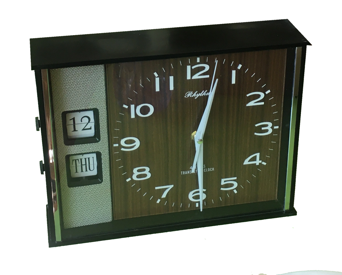 1970s battery wall clock Woodgrain face with manual flip calendar