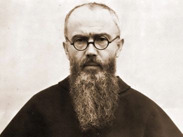 Portrait of a bearded man with round glasses.