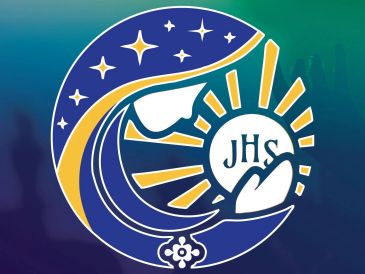 Religious emblem with a dove, stars, and hands holding a circle inscribed with 'JHS'.