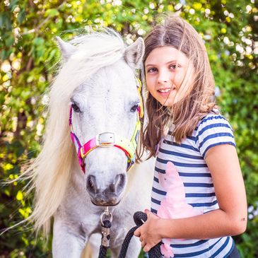 A kid receiving equine therapy in Eagleby