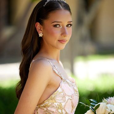 Young woman in elegant dress with flowers.