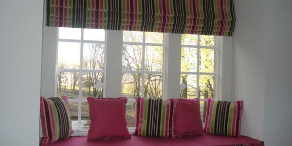 colourfull roman blind with matching cushions fitted in bourton on the water