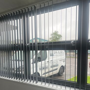 spa blinds of Royal Leamington Spa van in the background of an office with commercial blinds fitted