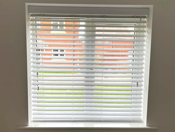 faux wood venetian blind fitted in a kitchen of a new build in leamington spa