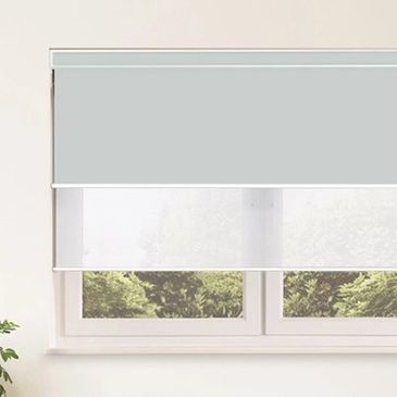 blue and transparent electric blind that has a motor inside of it, with a view of the garden outside