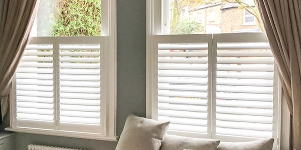 Cafe style shutters fitted side by side at a flat in royal leamington spa