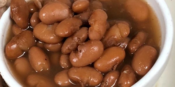 Pinto beans slow-cooked and seasoned with smoked turkey