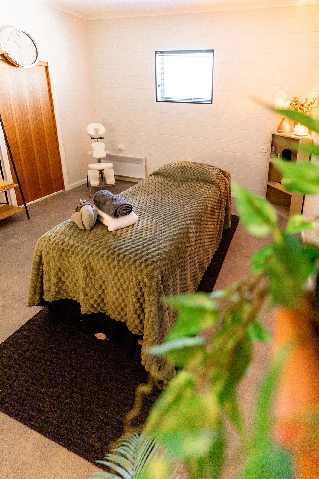 Calm massage room at Mike’s Massage in St Helens with soft lighting and a comfortable treatment tabl