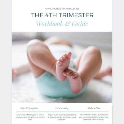 A workbook with the picture of a baby’s feet. 