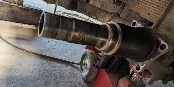 Close-up of a car part attached to an engine.