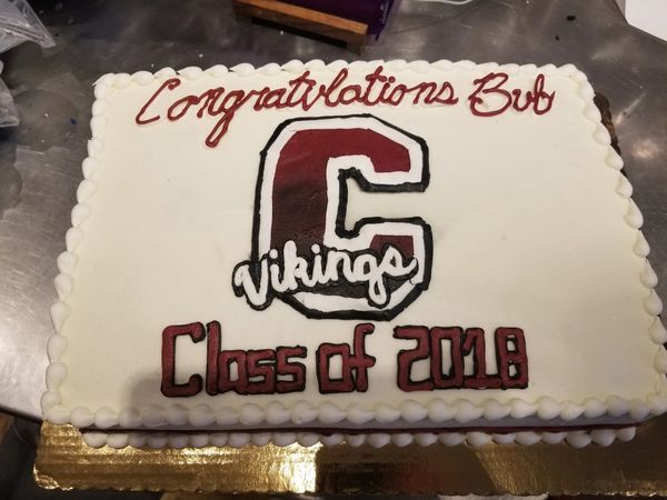 School logo graduation cake