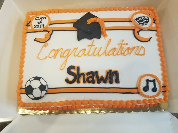 Sport, music, and theater graduation cake