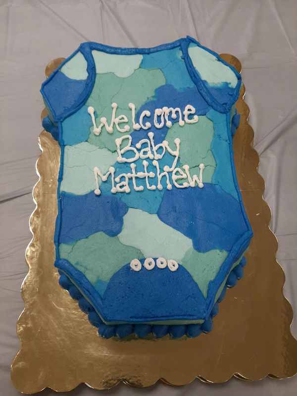 Onesie baby shower cake