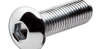 Close-up of a shiny hex socket head screw with threading.