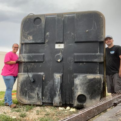 Titan Haulers junk removal team removing a hot tub during a residential cleanup job in Tooele Utah.