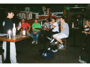 Scott Young teaching flair bartending classes in a Vancouver group seminar.