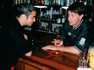 Scott Young coaching working flair bartending bar bets behind the bar at The Roxy in Vancouver, BC.