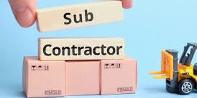 A large box with tiles above with the written words "Sub contractor" and a toy tractor next to it.