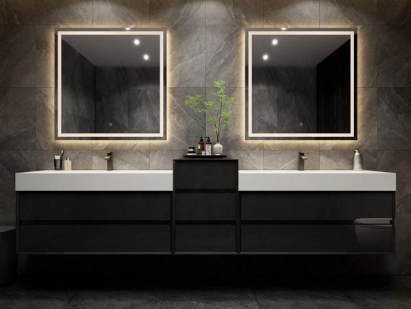 Modern double sink bathroom vanity with illuminated mirrors.