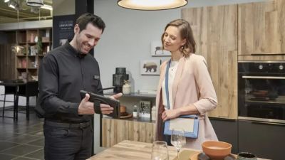 Couple enjoying a moment in the kitchen.
