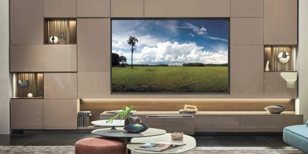 Modern living room with a large TV displaying a scenic landscape.