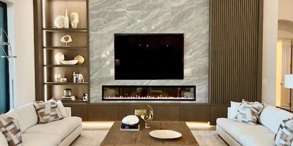Modern living room with fireplace and TV.
