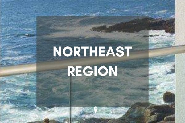 Text 'Northeast Region' over ocean scenery.