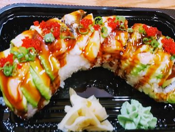Inside- Salmon Outside- Eel (unagi), Ebi(cooked shrimp), Tobiko , and eel sauce.