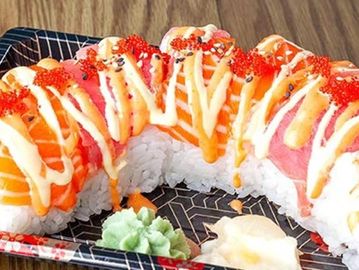 Inside: Spicy tuna, Outside: Salmon, tuna, white sauce , and spicy mayo
