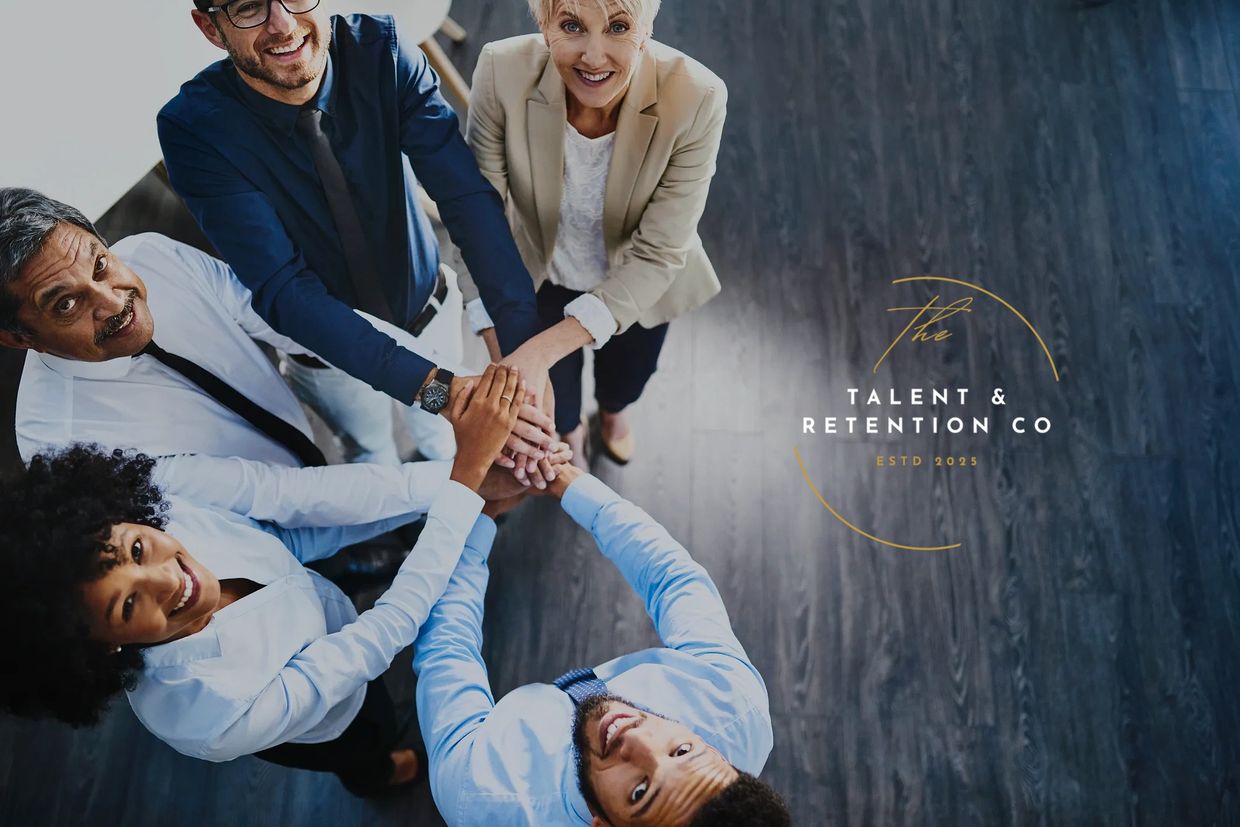 Diverse team joining hands in unity, symbolizing collaboration and teamwork.