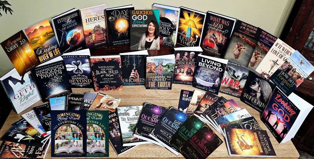Collection of spiritual and motivational books by Alexys V. Wolf displayed on a table.