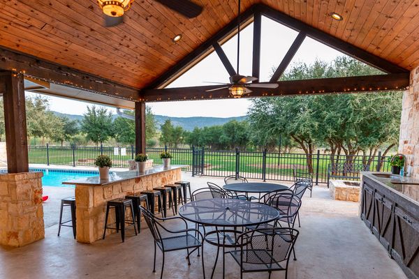 This is an image of outdoor dining and kitchen.