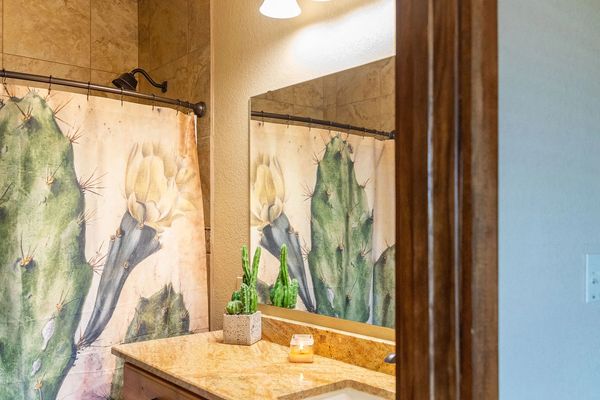 This is an image of a bathroom with a tub/shower combo.