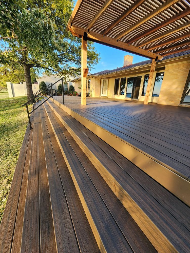 Wooden deck under construction with a drill on the planks.