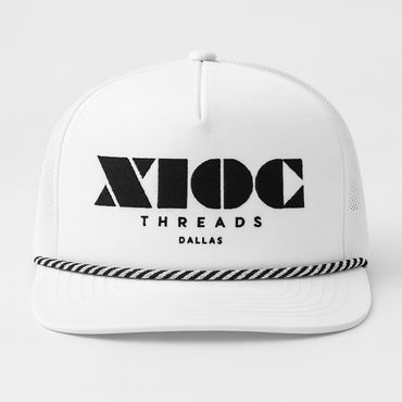 White snapback hat with bold black geometric logo and text.