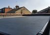 EPDM roof renewal with new red clay ridges