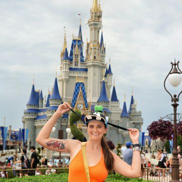 Liz Disneybounding as Goofy in front of Cinderella Castle