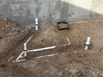 Rough in plumbing for a bathroom group on a new construction build