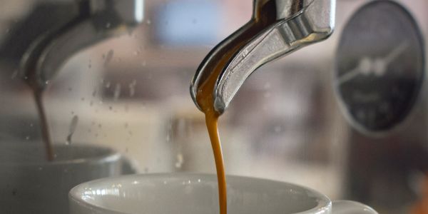 Pouring an espresso shot.