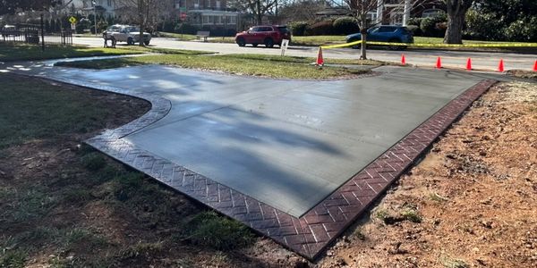 Stamped border with a broom finish interior in Asheville, NC. This job was on Kimberly Avenue near t
