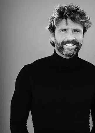 Jesse Looper smiling at the camera, daydreaming of building muscle and losing fat for his clients